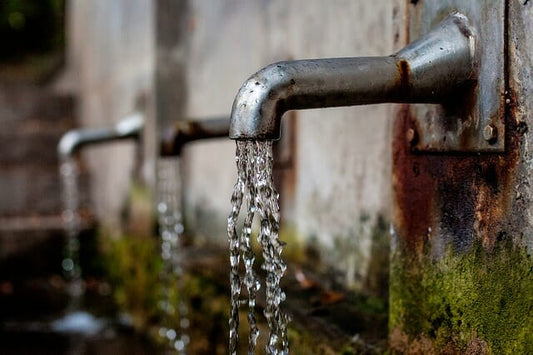 Mitigating Impacts of Contaminated Drinking Water with Soluble Zeolite
